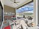 Beautiful outdoor living space with screened-in patio overlooking a serene lake view and comfortable seating at 4300 Barletta Ct, Wesley Chapel, FL 33543