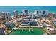 Aerial view of a beachfront building with a marina, surrounded by stunning ocean views and nearby attractions at 445 Hamden Dr # 502, Clearwater Beach, FL 33767