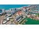 Breathtaking aerial view of a coastal building with a marina and easy access to the beach at 445 Hamden Dr # 502, Clearwater Beach, FL 33767