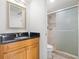 Bathroom featuring vanity with granite counters and walk-in shower with glass doors at 445 Hamden Dr # 502, Clearwater Beach, FL 33767