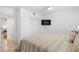 Bright bedroom featuring a comfortable queen bed, closet, and TV at 445 Hamden Dr # 502, Clearwater Beach, FL 33767