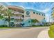 Exterior view of Clearwater Marine Aquarium showing the building's design, marine themed decorations, and palm trees at 445 Hamden Dr # 502, Clearwater Beach, FL 33767