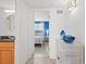 Hallway with view to the bedroom showcasing beach themed decor and bright paint at 445 Hamden Dr # 502, Clearwater Beach, FL 33767