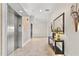 Well-lit hallway featuring modern decor and elevator access at 445 Hamden Dr # 502, Clearwater Beach, FL 33767