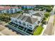 Aerial view of white townhomes with sidewalks and green spaces in a desirable location at 4717 W Mccoy St # 2, Tampa, FL 33616