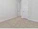 Neutral bedroom featuring carpeted floors and minimalist decor at 4717 W Mccoy St # 2, Tampa, FL 33616
