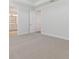Neutral bedroom features carpeted floor and a door to an adjacent bathroom at 4717 W Mccoy St # 2, Tampa, FL 33616