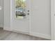 Bright entryway featuring hardwood floors, white door, and a view to the outdoors at 4717 W Mccoy St # 2, Tampa, FL 33616