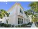 A detailed shot of the townhome's exterior, accented by lush greenery and expansive windows for natural light at 4717 W Mccoy St # 2, Tampa, FL 33616