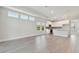 Spacious living room with light-toned wood flooring open to the kitchen area at 4717 W Mccoy St # 2, Tampa, FL 33616
