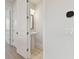 Powder room with pedestal sink, and decorative mirror at 4717 W Mccoy St # 2, Tampa, FL 33616