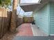 Exterior view of a patio connected to a blue house at 4721 W Iowa Ave, Tampa, FL 33616