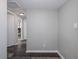 This hallway features wood flooring and access to several rooms at 4721 W Iowa Ave, Tampa, FL 33616