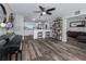 Open living room with hardwood floors connects to the kitchen island at 4721 W Iowa Ave, Tampa, FL 33616