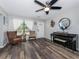 Inviting living room with hard surface floors, neutral paint, and a ceiling fan at 4721 W Iowa Ave, Tampa, FL 33616