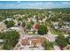 Aerial view of the home in a neighborhood with mature trees and city skyline in distance at 4767 6Th N Ave, St Petersburg, FL 33713
