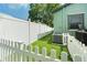 Backyard featuring fenced-in area with artificial turf, ideal for pets or play with the air conditioner at 4767 6Th N Ave, St Petersburg, FL 33713