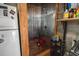 Shower stall with wooden base, corrugated metal walls, and a white refrigerator nearby at 4767 6Th N Ave, St Petersburg, FL 33713