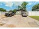 Driveway and garage with parking and vehicles on a sunny day at 4767 6Th N Ave, St Petersburg, FL 33713