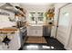 Modern kitchen with butcher block countertops, white cabinets, and open shelving at 4767 6Th N Ave, St Petersburg, FL 33713