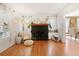 Bright living room featuring hardwood floors and a striking brick fireplace at 4767 6Th N Ave, St Petersburg, FL 33713