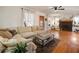 Bright living room with a comfortable sectional sofa, hardwood floors, and a cozy fireplace at 4767 6Th N Ave, St Petersburg, FL 33713