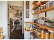 Walk-in pantry features open shelving and storage space for food and kitchen essentials next to kitchen at 4767 6Th N Ave, St Petersburg, FL 33713