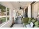 Inviting sunroom with ample natural light, cozy seating, and stylish decor, an ideal space to unwind at 4767 6Th N Ave, St Petersburg, FL 33713