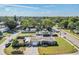 Aerial view of a well-maintained home with a spacious yard in a peaceful suburban neighborhood, perfect for families at 5004 Suwannee Dr, New Port Richey, FL 34652