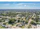 Expansive aerial view showcasing the neighborhood's lush greenery and residential streets at 5004 Suwannee Dr, New Port Richey, FL 34652