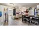 Inviting kitchen offers wood-look tile flooring, a breakfast bar, and matching white cabinetry at 5004 Suwannee Dr, New Port Richey, FL 34652