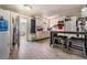 Charming kitchen features wood-look tile flooring, matching cabinets, and a breakfast bar with seating at 5004 Suwannee Dr, New Port Richey, FL 34652