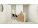 Hallway with a view into the bedroom and a modern desk area with stylish decor at 5137 Benjamin Eric St, Zephyrhills, FL 33541