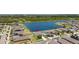 Aerial view highlighting the property's location near the lake, surrounded by well-maintained homes and landscaping at 5208 Dandelion St, Apollo Beach, FL 33572