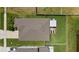 Aerial view of the property highlighting the backyard, screened patio, lawn, and overall layout at 5208 Dandelion St, Apollo Beach, FL 33572