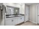 Clean bathroom offers double sinks, granite counters, white cabinets, tile floors, and a walk-in shower at 5208 Dandelion St, Apollo Beach, FL 33572