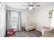 Bedroom with a neutral color scheme and a ceiling fan at 5208 Dandelion St, Apollo Beach, FL 33572