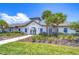 Charming community clubhouse featuring lush landscaping, a walkway, and an inviting entrance at 5208 Dandelion St, Apollo Beach, FL 33572