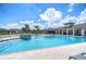 Resort-style community pool featuring tanning ledges, sun loungers, and ample space for relaxation at 5208 Dandelion St, Apollo Beach, FL 33572