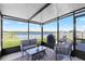 Screened lanai features a view of the pond and lounge seating at 5208 Dandelion St, Apollo Beach, FL 33572