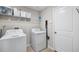 Laundry room with washer and dryer hookups and a storage shelf at 5208 Dandelion St, Apollo Beach, FL 33572