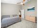 Bedroom with soft carpet, fan, and access to common living area at 5216 Kernwood Ct, Palm Harbor, FL 34685