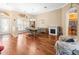 Open dining room with hardwood floors, fireplace, and easy access to the kitchen at 5216 Kernwood Ct, Palm Harbor, FL 34685