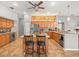 Spacious kitchen features granite countertops, stainless steel appliances, a center island, and plenty of storage at 5216 Kernwood Ct, Palm Harbor, FL 34685