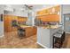Spacious kitchen featuring a central island, stainless steel appliances, and custom backsplash at 5216 Kernwood Ct, Palm Harbor, FL 34685