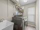 Laundry room featuring modern washer, dryer, and utility sink at 5216 Kernwood Ct, Palm Harbor, FL 34685