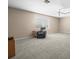 Spacious living room featuring plush carpeting and comfortable chair at 5216 Kernwood Ct, Palm Harbor, FL 34685