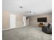Spacious room featuring soft carpeting, television and comfortable seating at 5216 Kernwood Ct, Palm Harbor, FL 34685