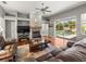 Cozy living room with fireplace and sliding door leading to outdoor pool area at 5216 Kernwood Ct, Palm Harbor, FL 34685