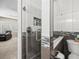 Modern shower with glass door, gray and white tiles, built in niche, and stylish fixtures at 5216 Kernwood Ct, Palm Harbor, FL 34685